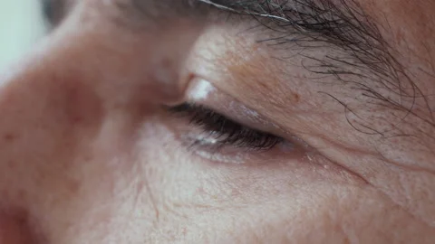 Close up old man eye.Old man looking his mobilephone. 4K Macro detail. Stock Footage 155279327