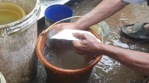 Close up of old man hands washing dishes outdoors Stock Footage 315189348