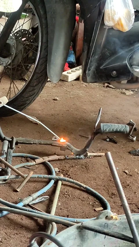 Close up of old man's hand using electric welding Stock Footage 308465582