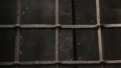 Close up old medieval restored black metal door reinforced with overlaid plates Stock Footage 98154287