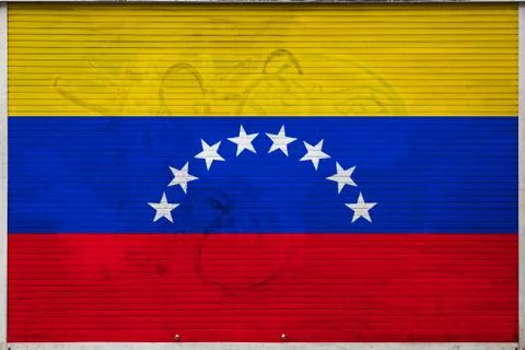 Close-up of old metal wall with national flag of Venezuela. Concept of Venezu Stock Photos