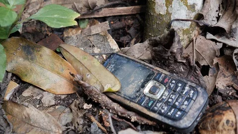 Close up of old mobile phone, remains of traditional burial, Trunyan, Bali Stock Footage 140275437