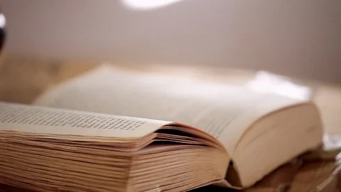 Close up of an old paperback book, Tracking to the right Stock Footage 124937798