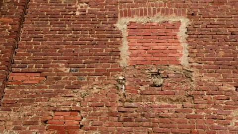 Close-Up of an Old Red Brick Wall with Mismatched Repair Stock Footage 318605668