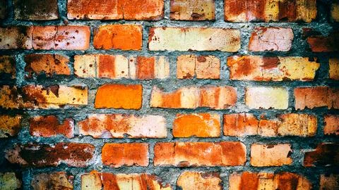 Close-up of an old red brick wall. Added vintage camera and vignetting effect Stock Photos