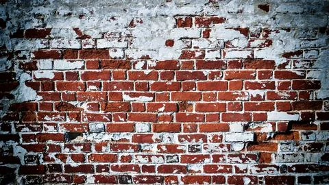 Close-up of an old red brick wall with peeling plaster. Vignetting effect added Stock Photos