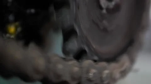 Close-up of an old rotating roller chain and drive star Stock Footage 172452732