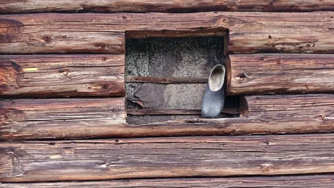 Close-up of Old Rubber Boot on a Rustic Wooden Window Sill 4K Video stock 335098888