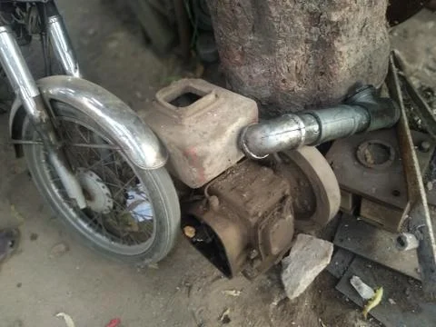 Close up old rust water pump under sunlight Stock Photos