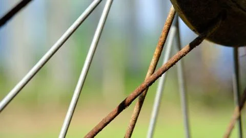 Close up old rustic motorcycle wheel bars Фото