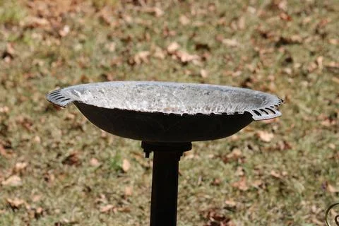 Close up of an Old Rusty Broken Birdbath Stock Photos