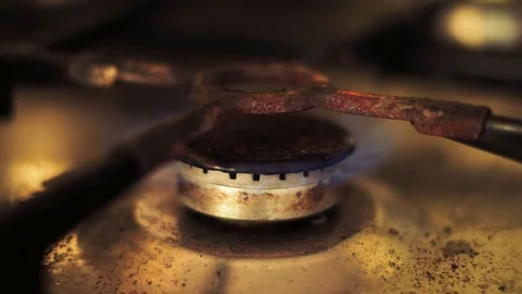 Close up old rusty dirty gas oven top burner stove fire starting Stock Footage 94821524