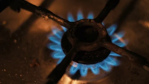 Close up old rusty dirty gas oven top burner stove fire starting Stock Footage 94832010