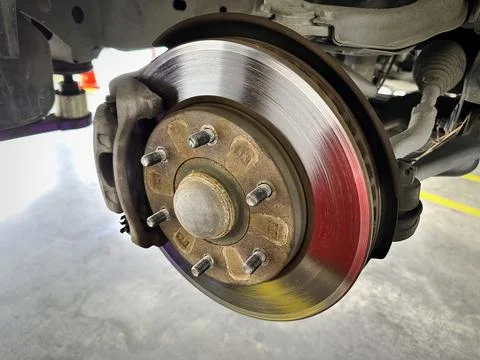 Close-up Old Rusty Disc Brake Caliper Under Inspection and Repair Stock Photos