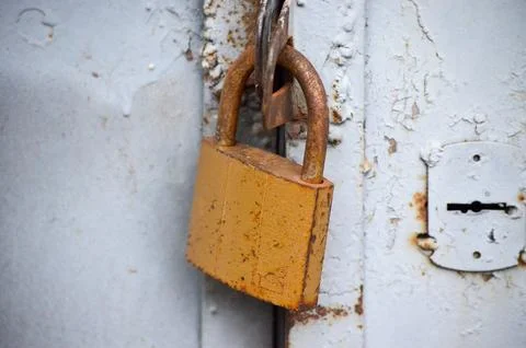 Close-up of an old rusty garage lock. Stock Photos