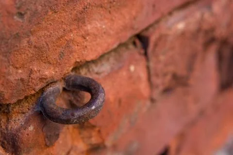Close up old rusty hinge on brick wall Stock-Fotos