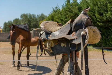 Close Up of Old Saddle on Blur Background in a Sunny Day Stock Photos