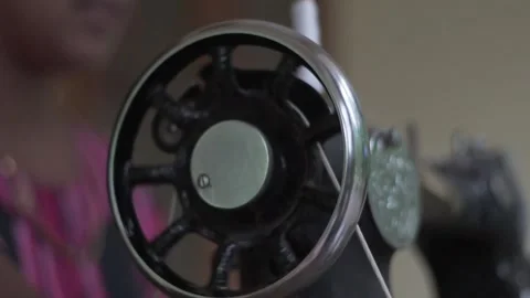 Close up of old sewing machine with women's hands on table slow motion Video stock 130851687