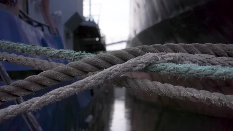 Close-up of old ship nautical knot ropes in the shape of an X cross. Footage Stockbeeldmateriaal 137855386