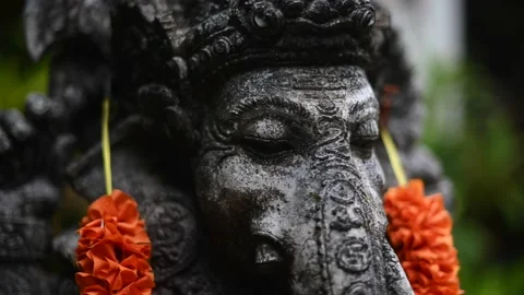 Close up of Old statue Ganesha in garden with decorations Stock Footage 237013124