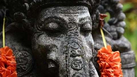 Close up of Old statue Ganesha in garden with decorations Stock Footage 237355835