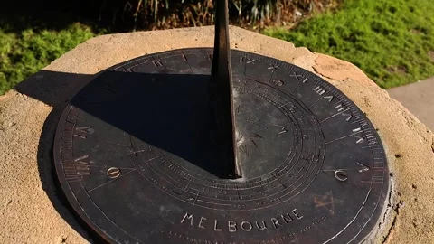 Close up of old sundial casting a moving shadow on numbered face showing ti.. Stock Footage 333937254