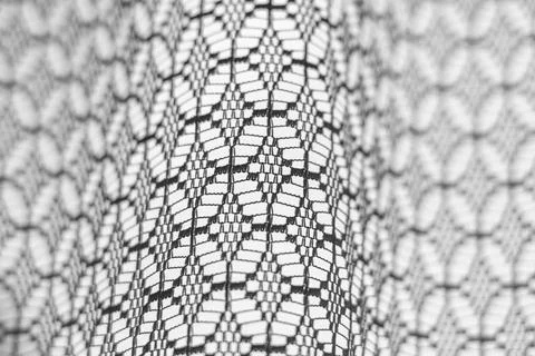 Close-up of an old tulle window. Stock Photos