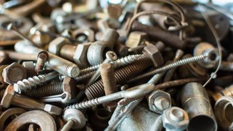 Close-up old used spare part, rust bolts and knots many sizes Stock Photos