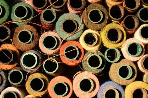 Close up old vintage thread coils multicolored Stock Photos