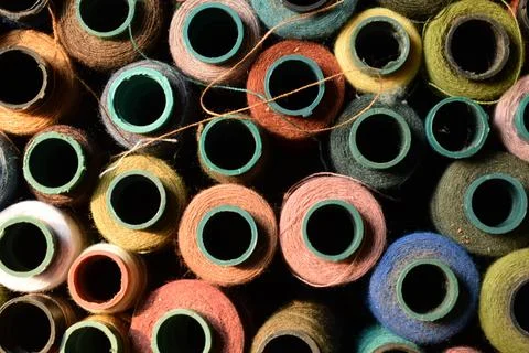 Close up old vintage thread coils multicolored Stock Photos
