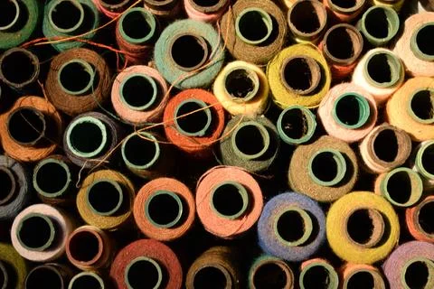 Close up old vintage thread coils multicolored Stock Photos