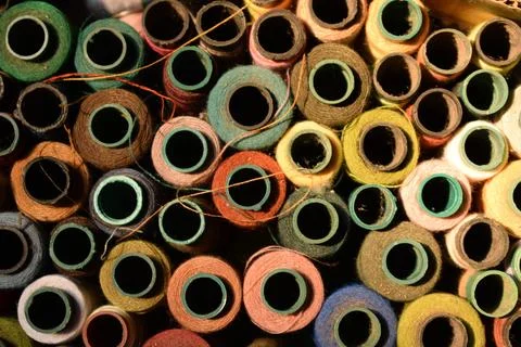 Close up old vintage thread coils multicolored Stock Photos