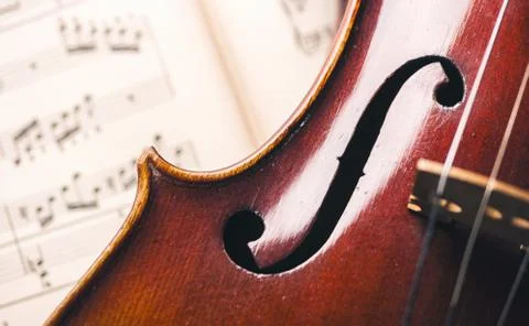 Close up of an old violin on paper notes Stock Photos