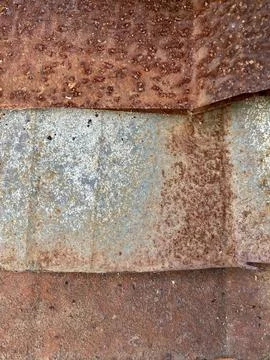 Close-up of old, weathered, and heavily rusted corrugated iron sheets Stock Photos