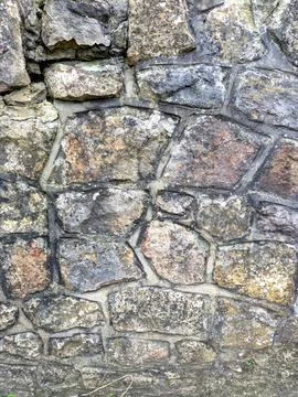 Close up of old weathered bricks outside in dark reds Foto stock