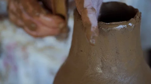 Close-up of old woman's hands making traditional earthenware on wheel Stock Footage 93132958