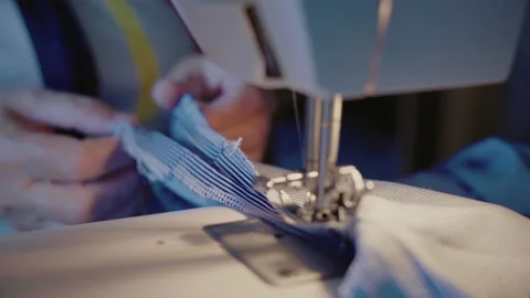 Close-up, Old Woman's Hands Prepare Matter for Sewing on Sewing Machine Stock Footage 136440500
