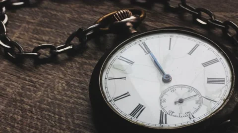 Close up of an old worn gold pocket watch. Vintage watch Time lapse. Dark backgr Stock Footage 237634143