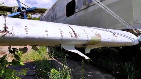 A close-up of an old wrecked passenger plane that has been decommissioned and st Video stock 155780761