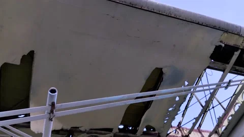 A close-up of an old wrecked passenger plane that has been decommissioned and st Stock Footage 155780814