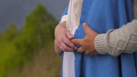 Close up of an older man's hands arms around a woman's. Stock-Footage 258789329