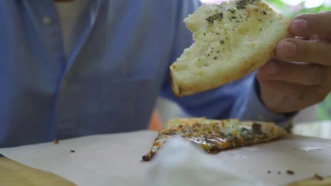 Close-up of an older man's hands with a slice of freshly made cheese pizza Stock Footage 284297027