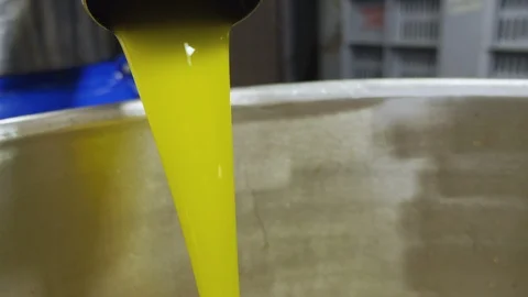 Close up on olive oil flowing- Olive Oil production Stock Footage