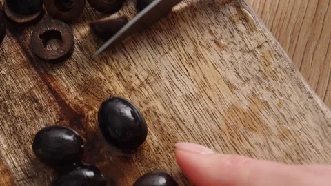 Close-Up of Olive Slicing on Board. Stock Footage 256185734