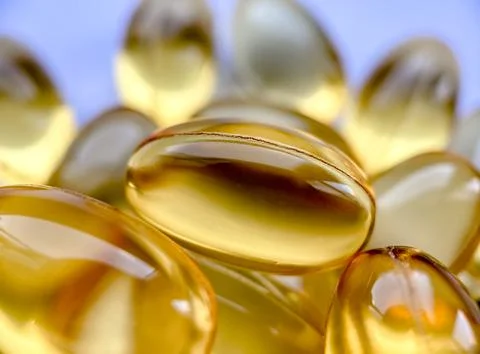 Close-up omega-3 capsules. Polyunsaturated fatty acids. The concept of a healthy Stock Photos