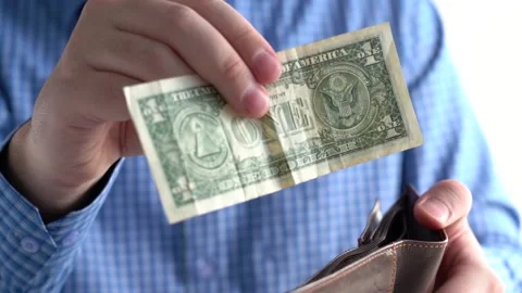 Close-up of one dollar and wallet in hands. Stock Footage 156815624