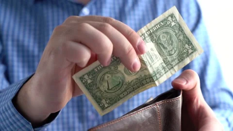 Close-up of one dollar and wallet in hands. Stock Footage 166997187