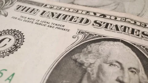 A close-up of a one-dollar bill with a sliding motion. Stock Footage 301446583