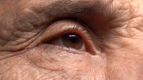 Close-up one eye of an elderly man Stock Footage 145465613