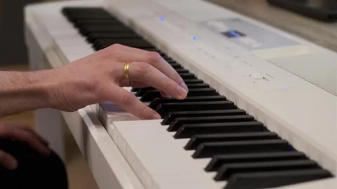 Close-Up One Hand Playing Digital Piano Minimal Clean Setting Stock Footage 331905369